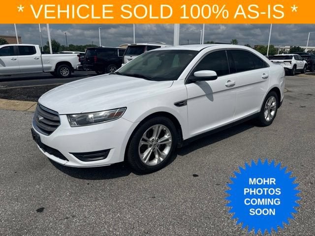 2013 Ford Taurus SEL in Oxford White — front three-quarter view